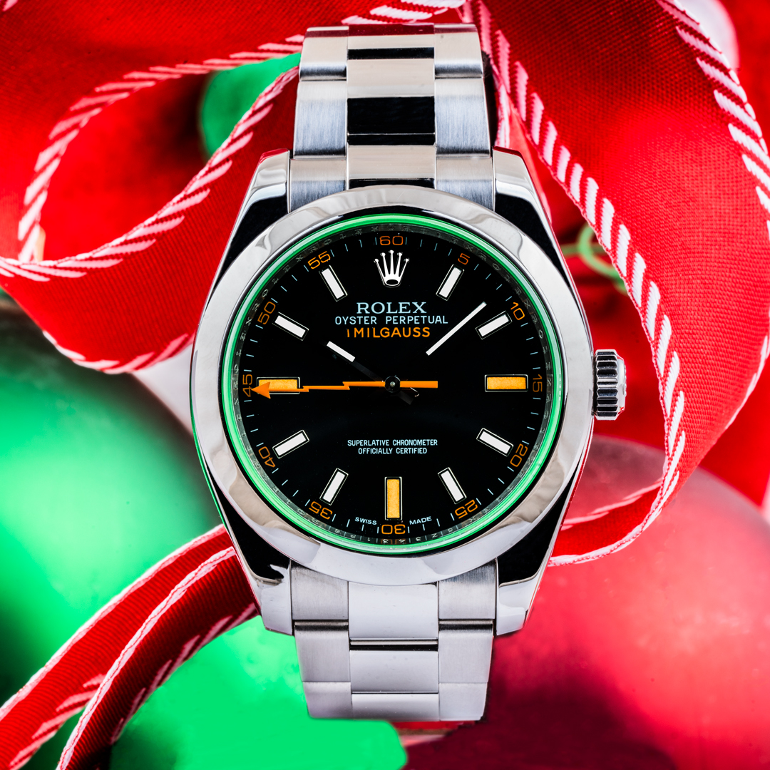 Pre-owned men's Rolex Milgauss in stainless steel with a black dial and orange markers.