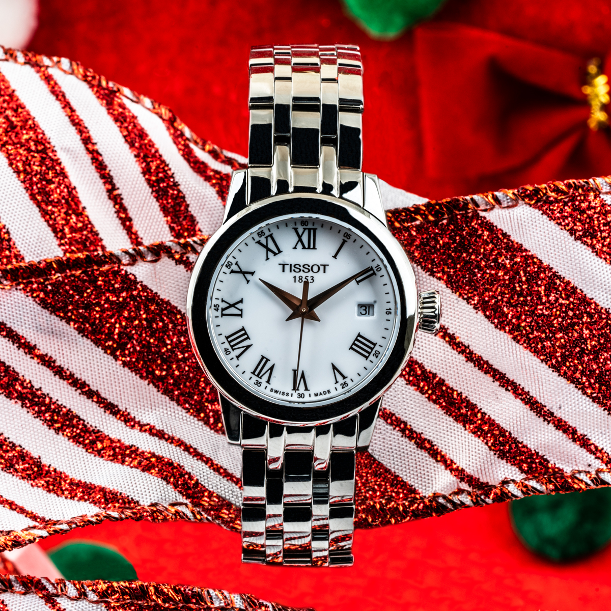 New women's Tissot Classic Dream Lady in stainless steel with a white Roman numeral dial.