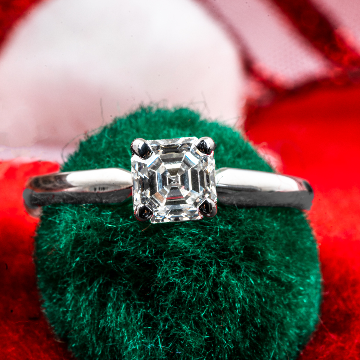 White gold solitaire asscher cut diamond engagement ring.